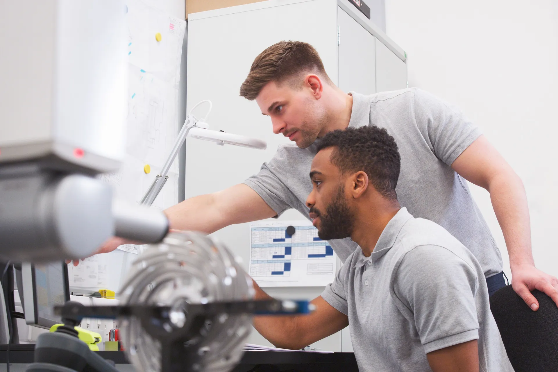Male Engineer Uses CMM Coordinate Measuring Machine In Factory