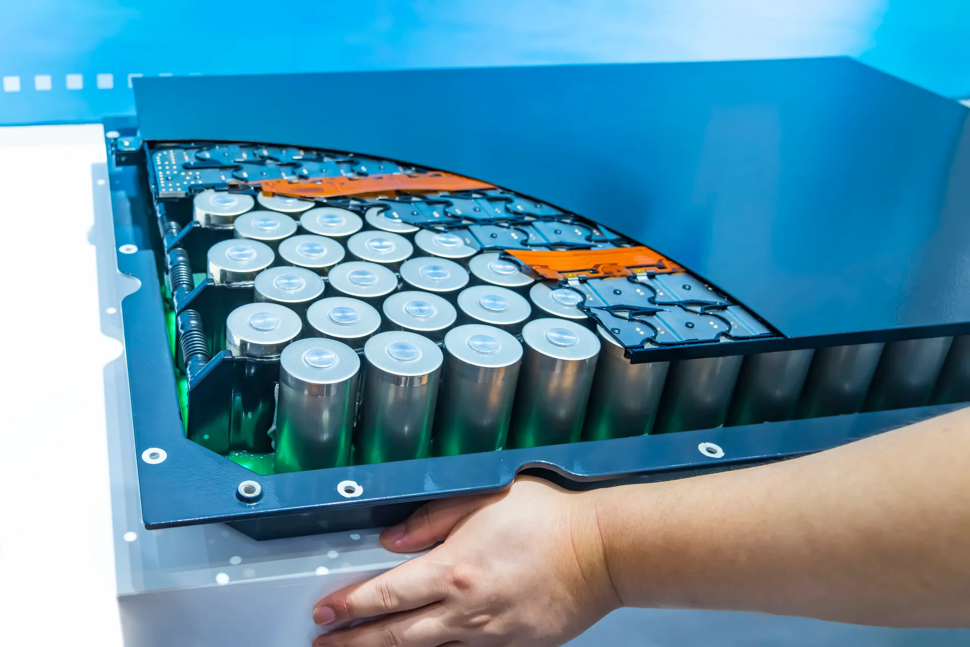 Hand with Lithium ion industrial high current batteries and connector