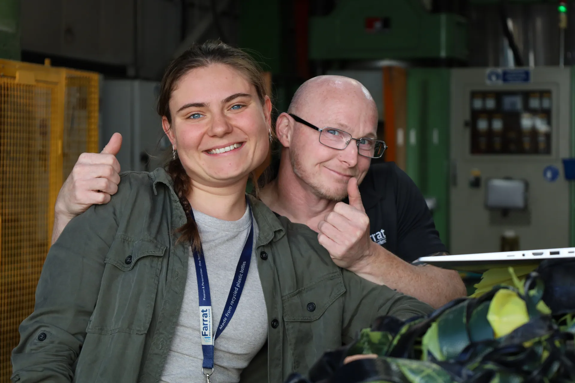 Two Farrat workers posing for camera