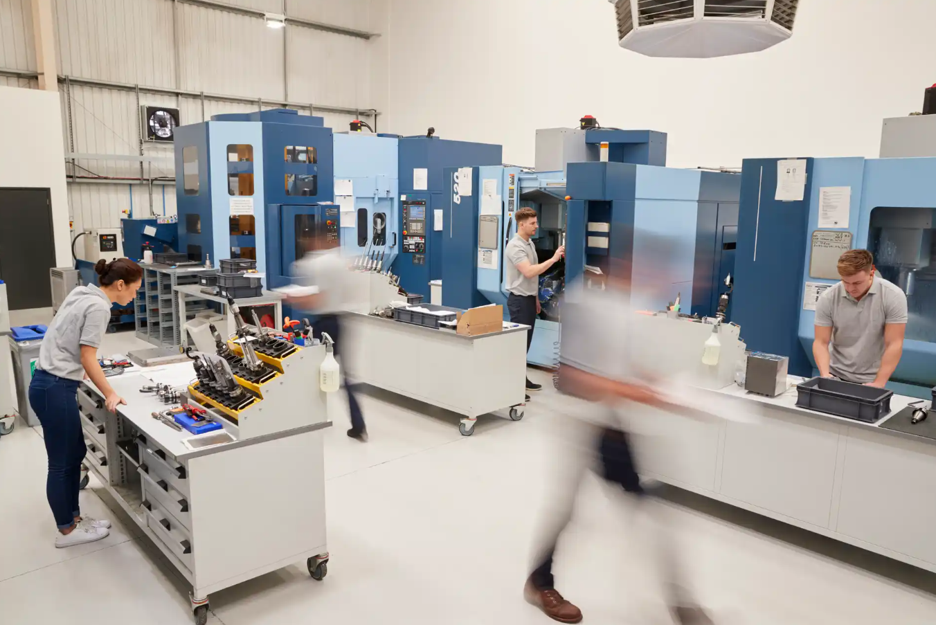 Image of a factory floor with engineers working