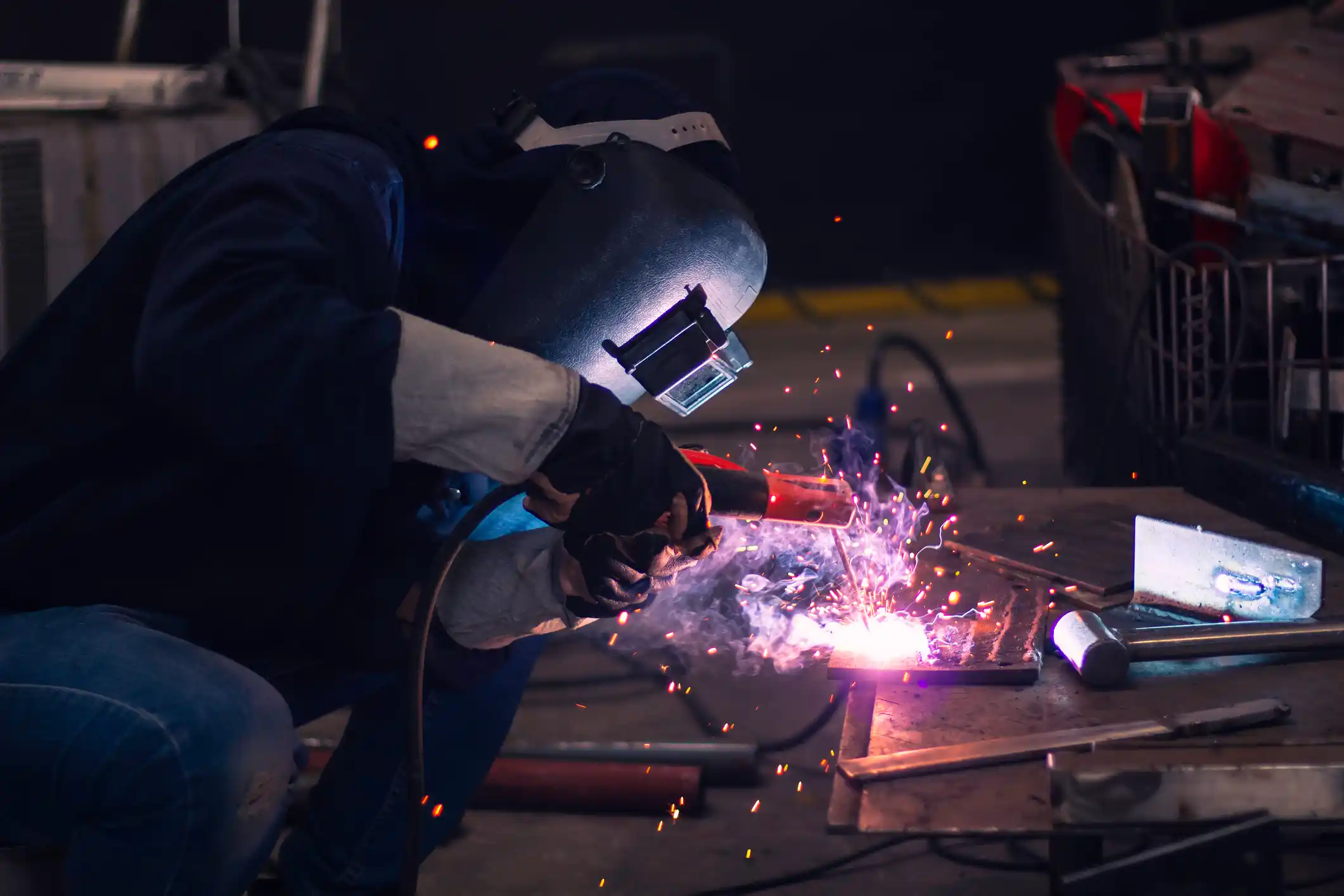 Skillful welders weld stainless steel in the factory