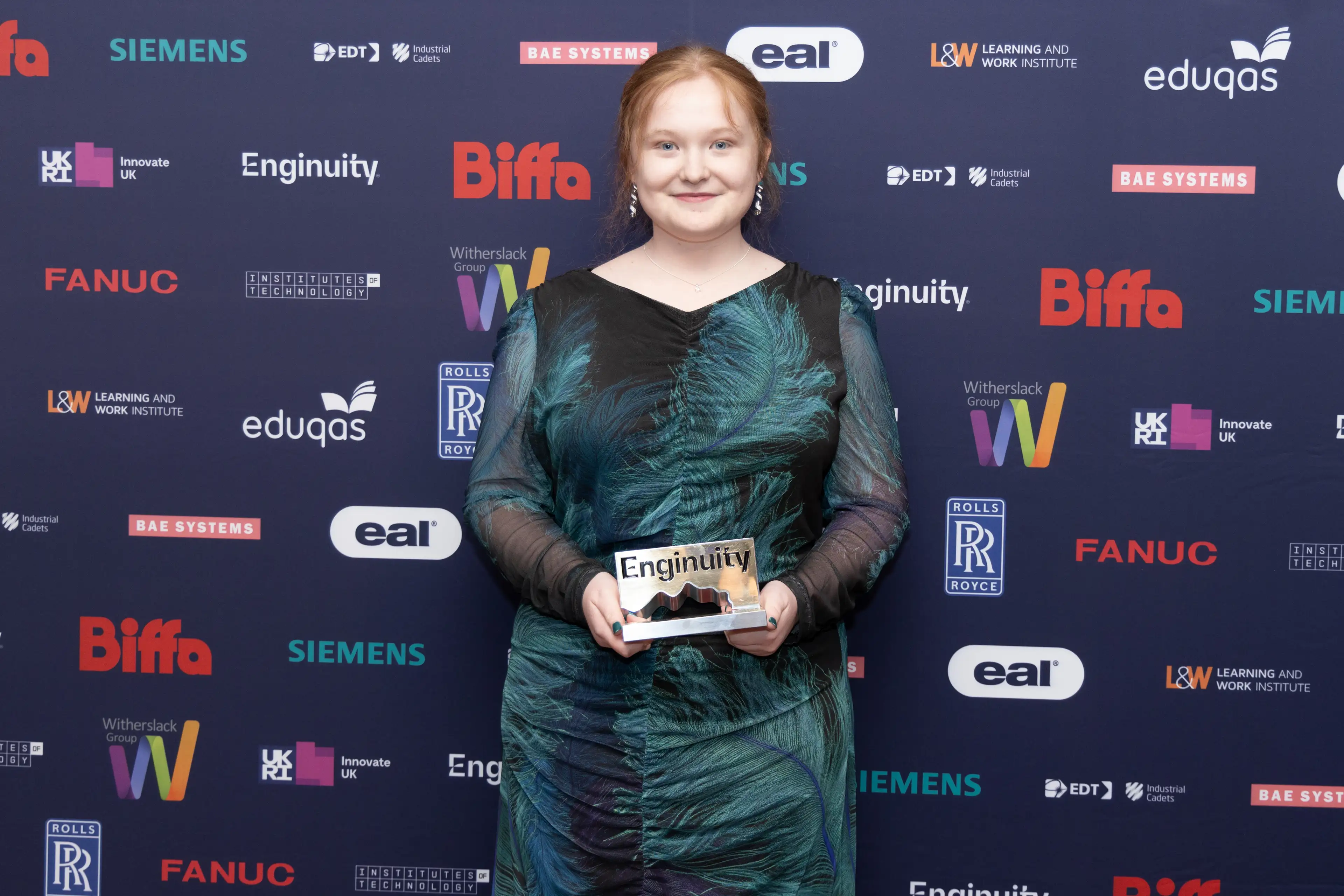 A picture of an award winner collecting their advanced level apprentice of the year