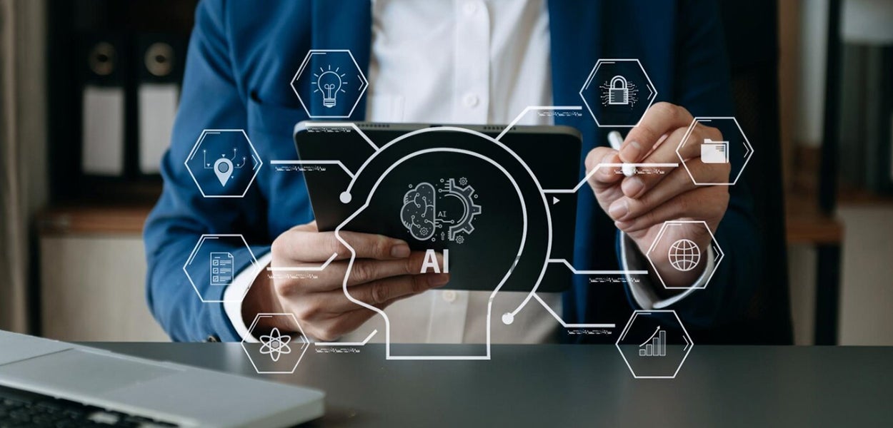 A man in the office with an AI illustration, matching article ‘How can governments use AI responsibly?’