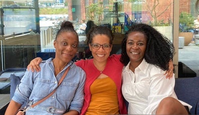 Three women smiling together