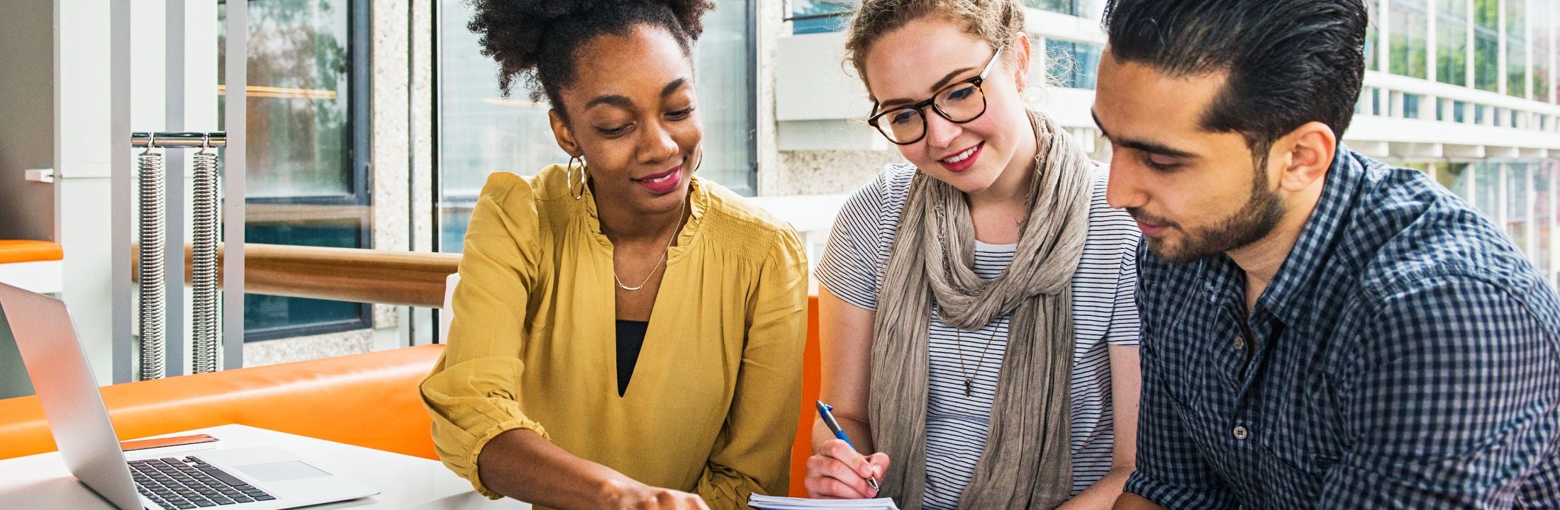Three teachers discussing Mixed Classroom-related topics
