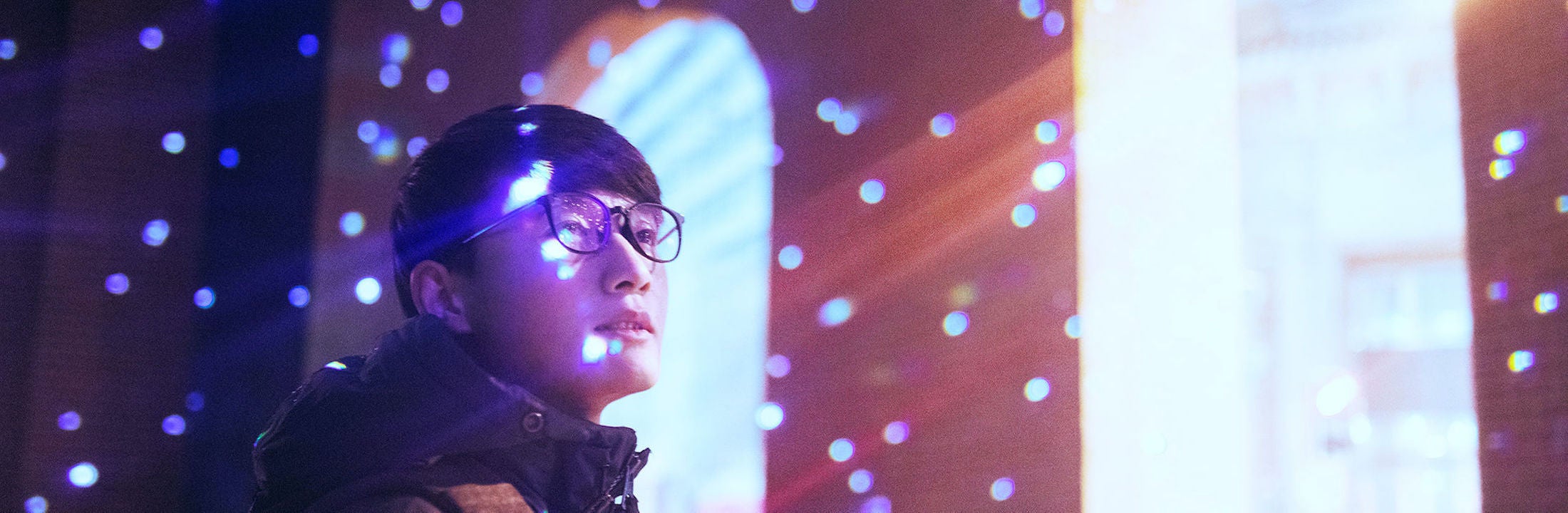 young person is surrounded by light