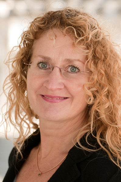 A close-up of a smiling woman