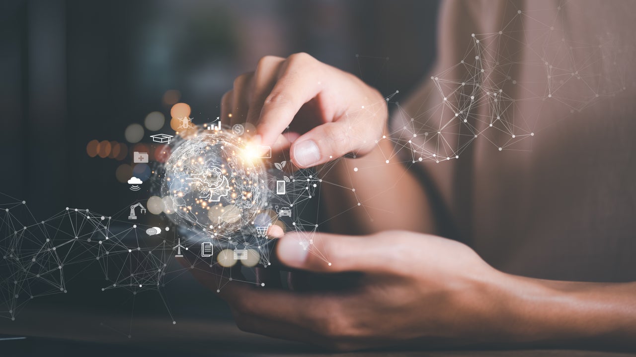 Hands holding a virtual network to depict AI.