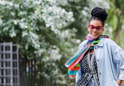 A woman smiles at the camera