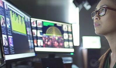 A student looks at data on a computer screen