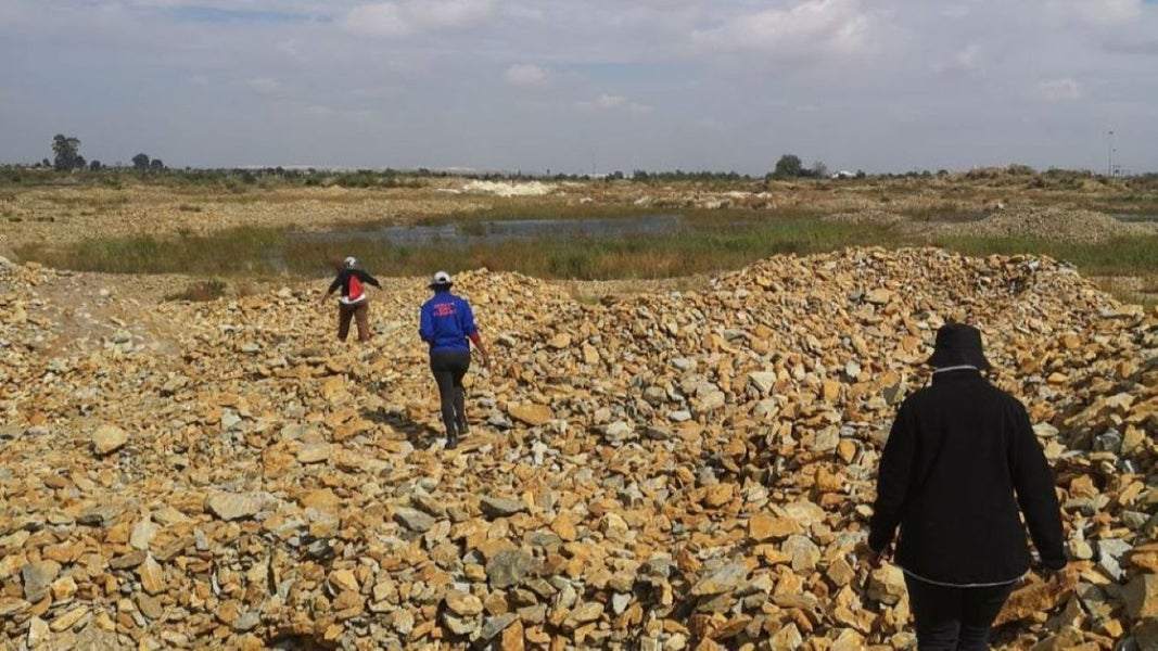 People walking towards the mine