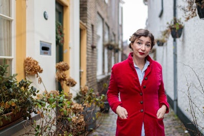 A woman in a red coat