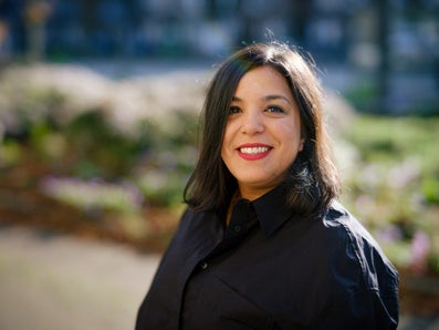 A woman smiles for the camera