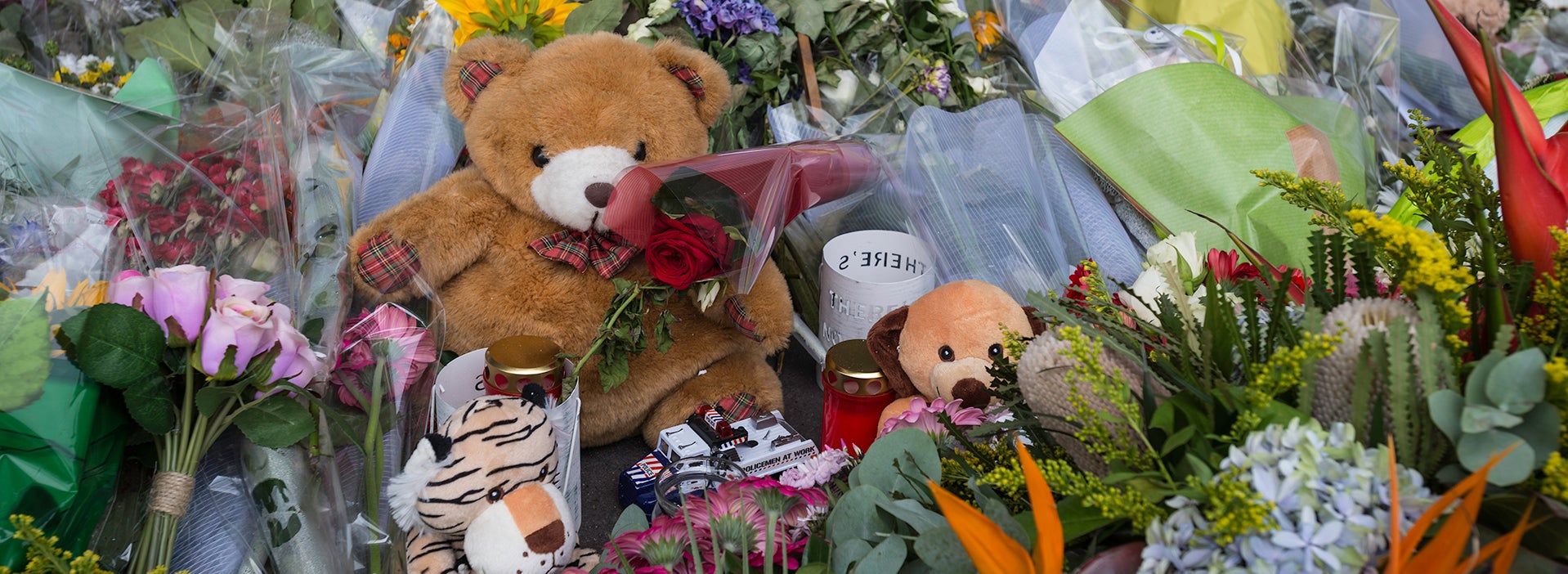 memeorial place with flowers and stuffed toys