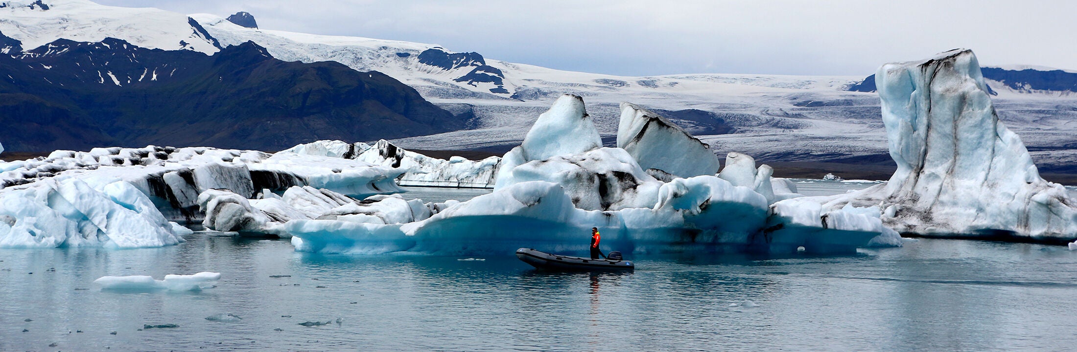 A boat in front of some ice floes