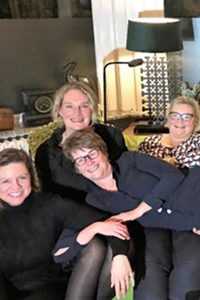 A group of women on a bench