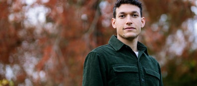 A man in a green jacket