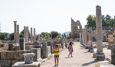  Woman walks around archaeological site