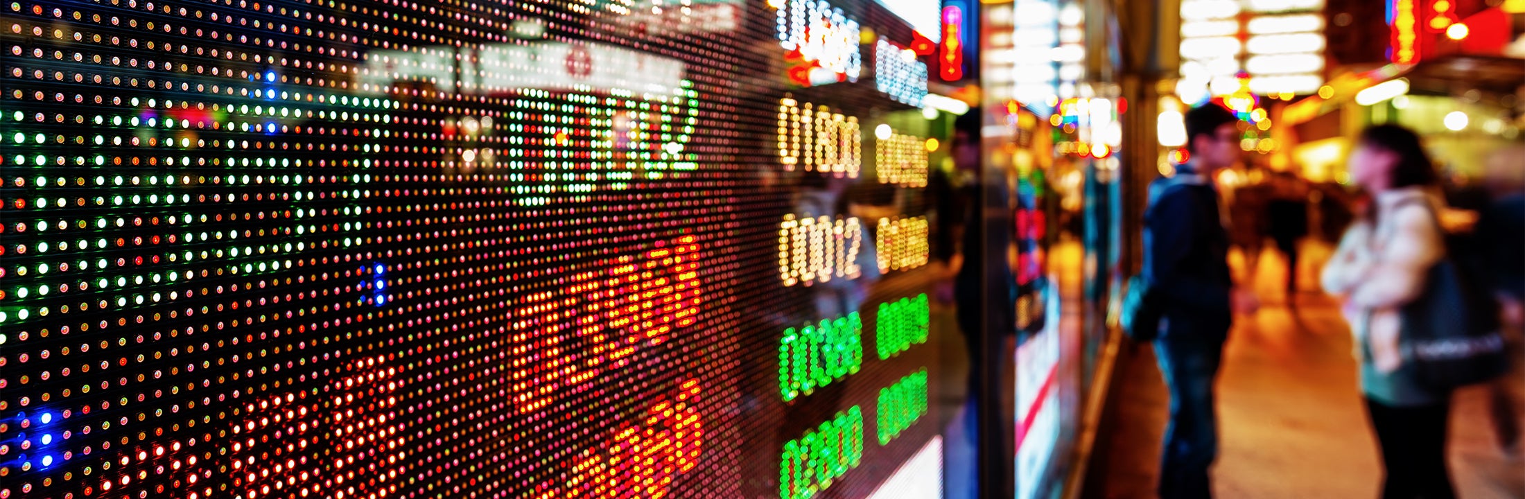 Shop windows and in the background two people having a conversation 