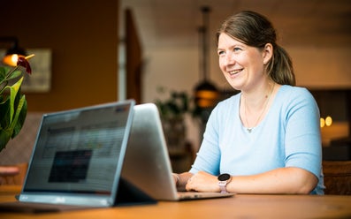 Cindy de Groot working on a laptop