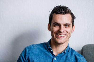 A man smiles at the camera