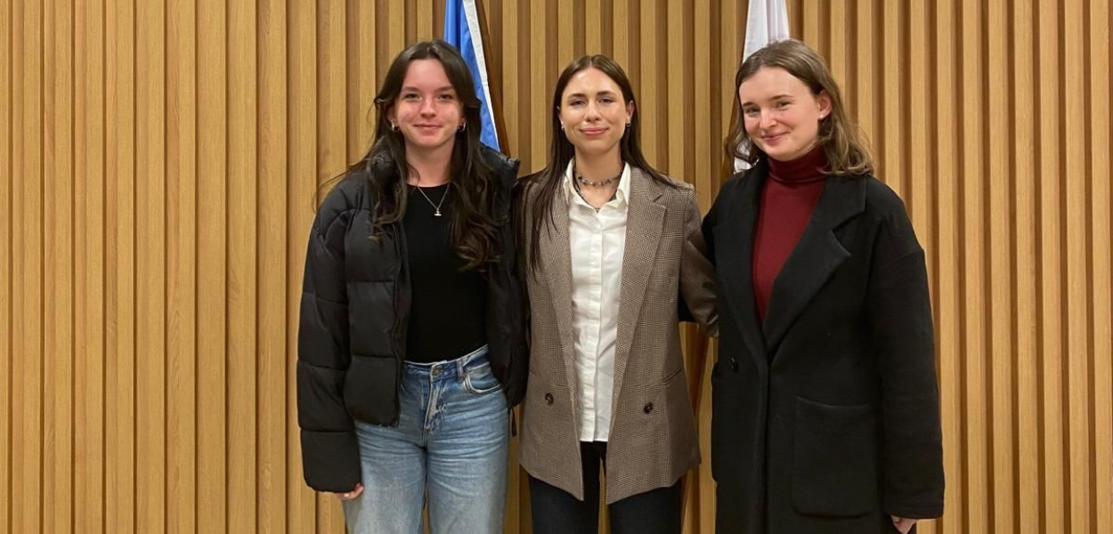 Three VU Amsterdam students pose at the United Nations in Geneva