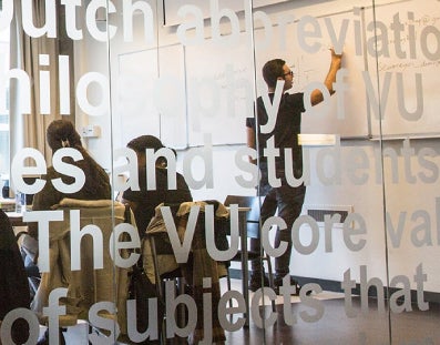 Teacher makes notes on the board during a training