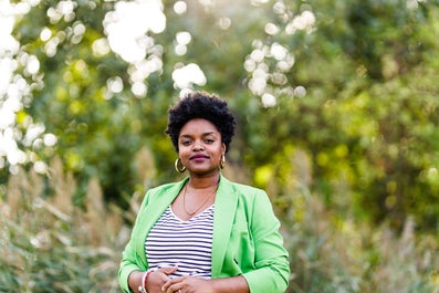 A woman in a green jacket