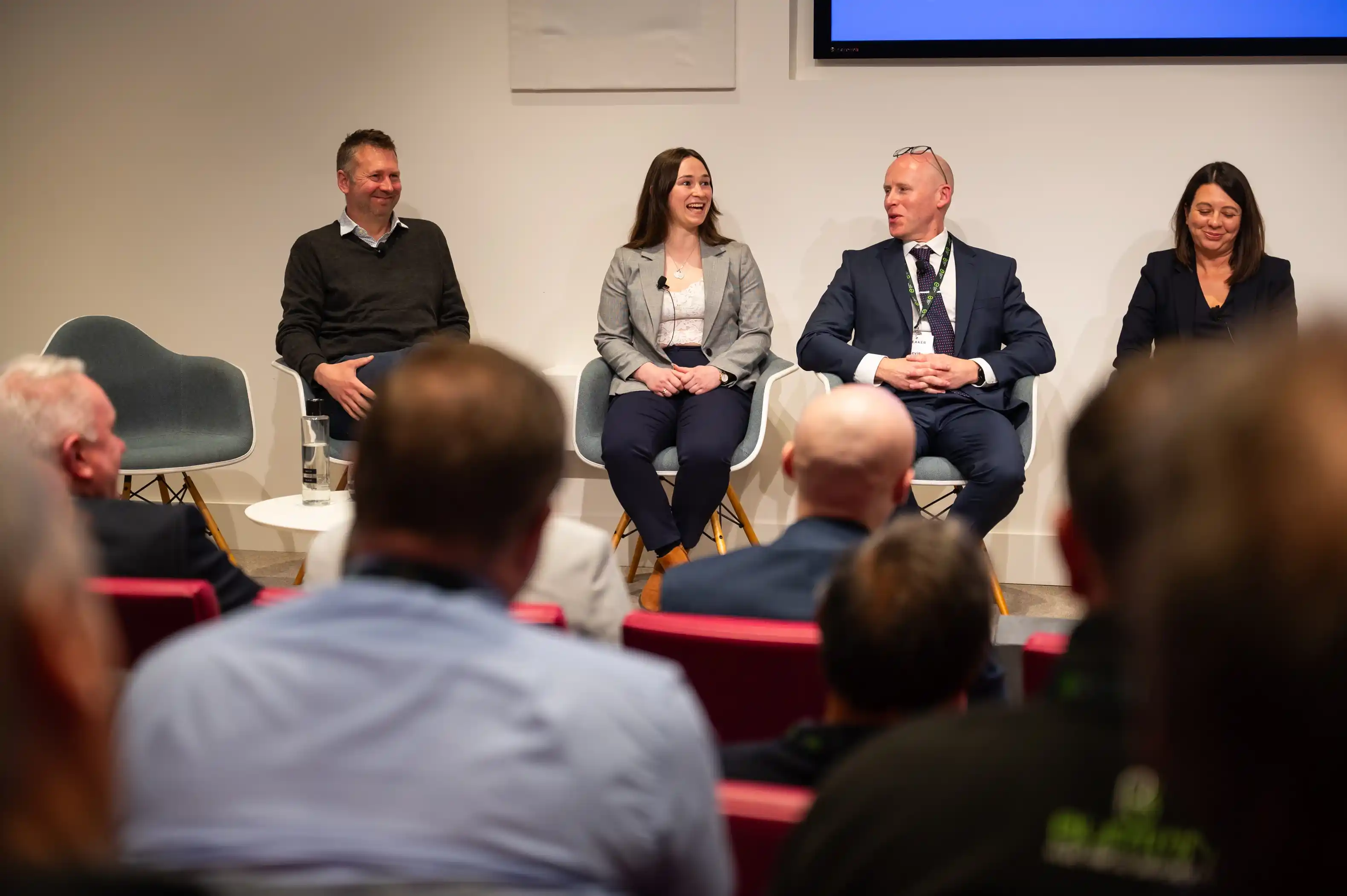 EAL's Kevin Sparrow sitting on stage next to three other panel speakers at the Electrical Installation Seminar.