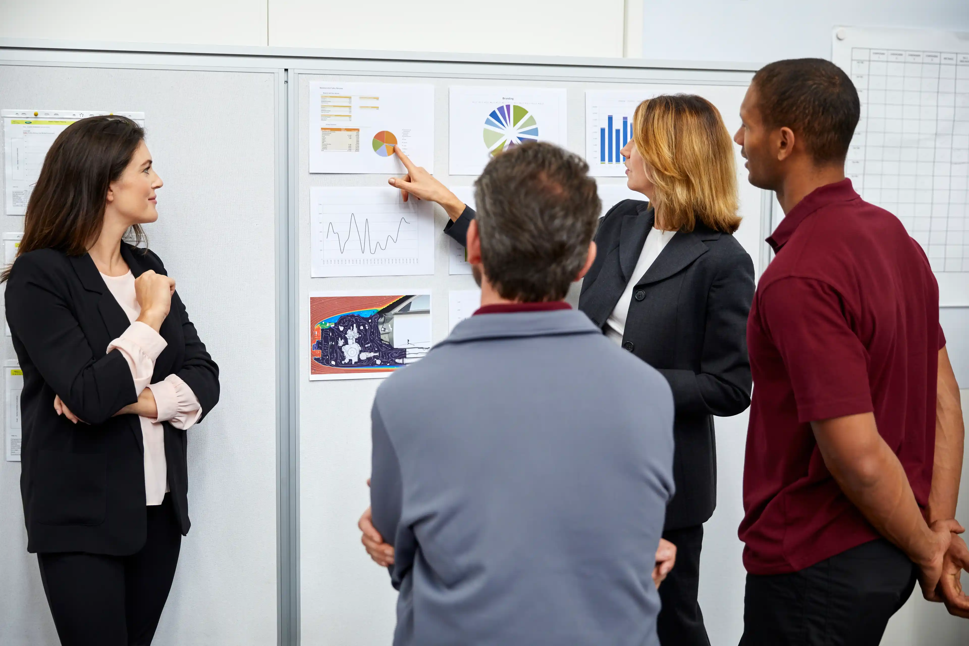 Four workers in discussion 