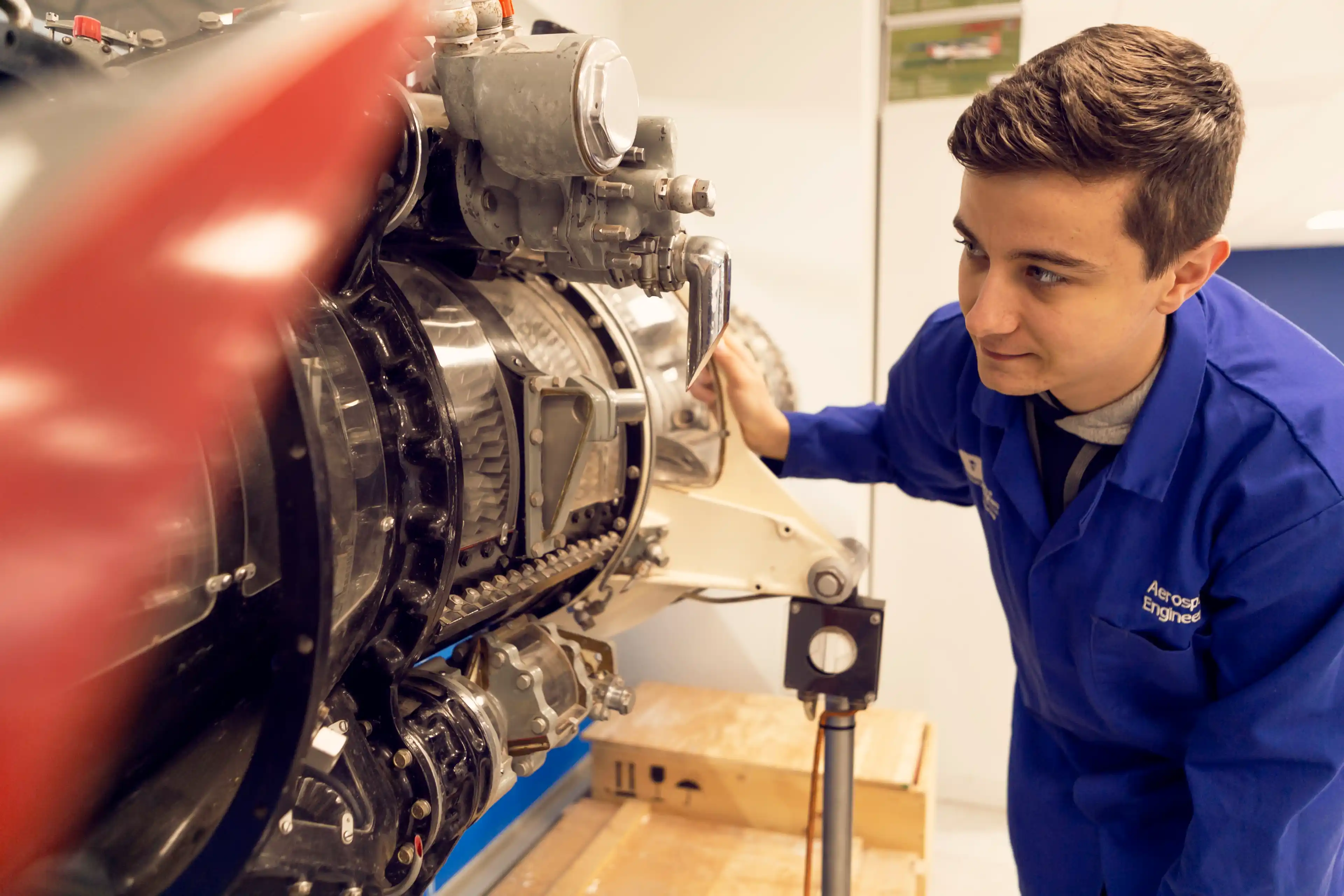 Engineering student inspecting some equipment