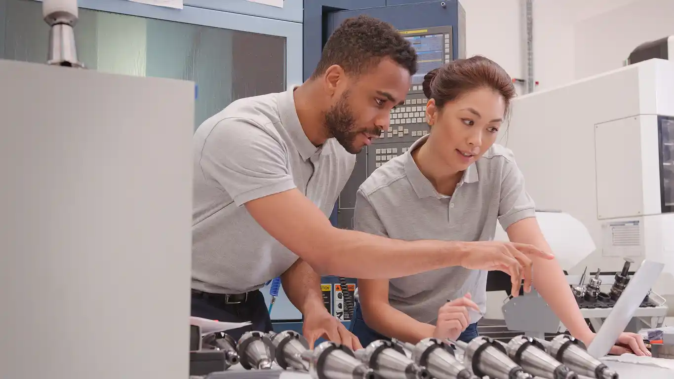 Two young engineers in a workshop