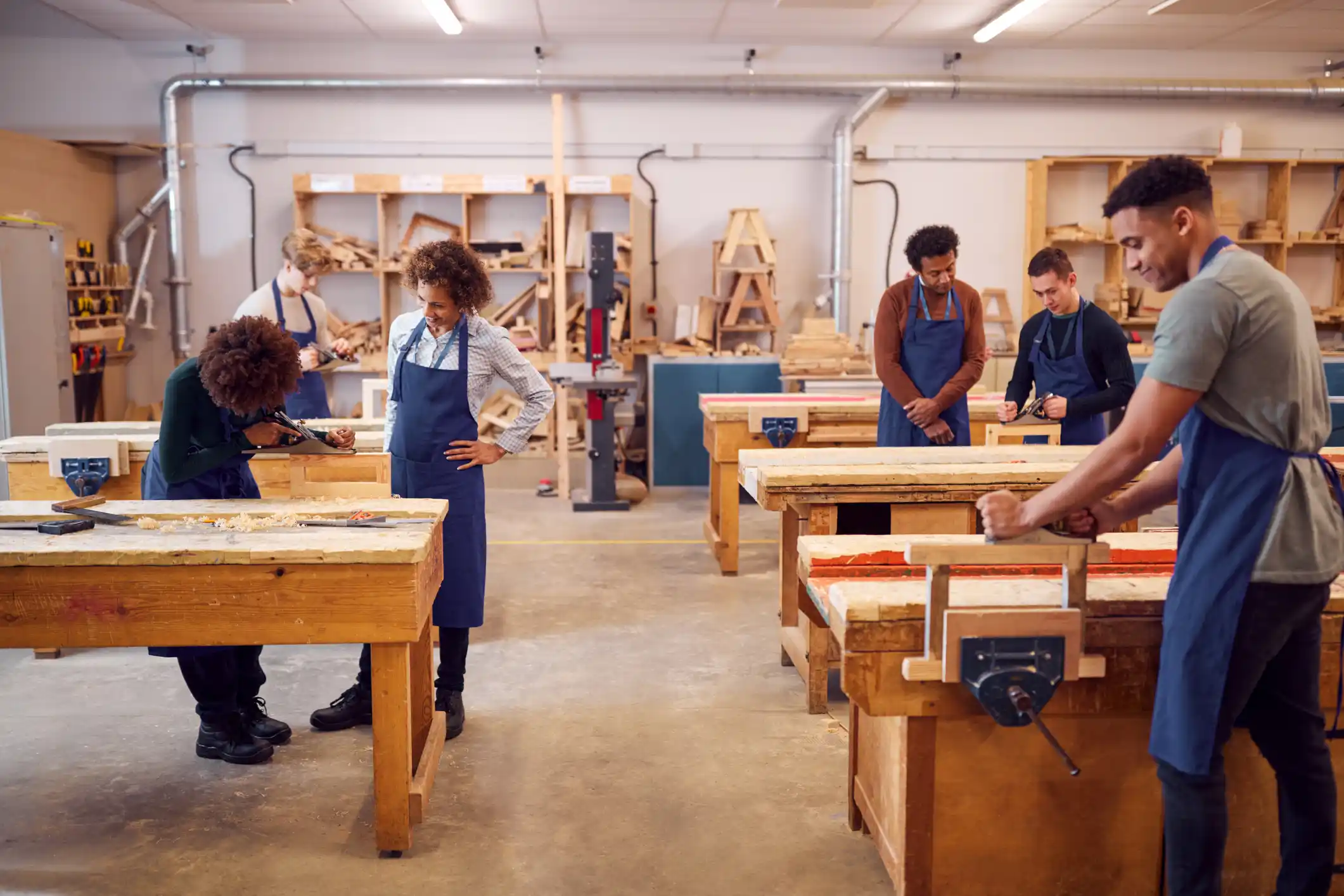 Learners in a woodworking classroom