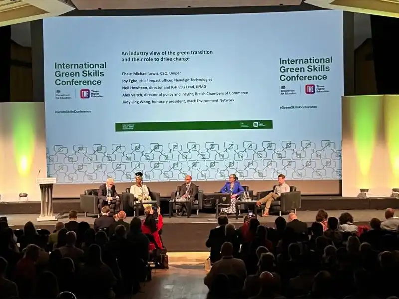 Audience and speakers at a conference