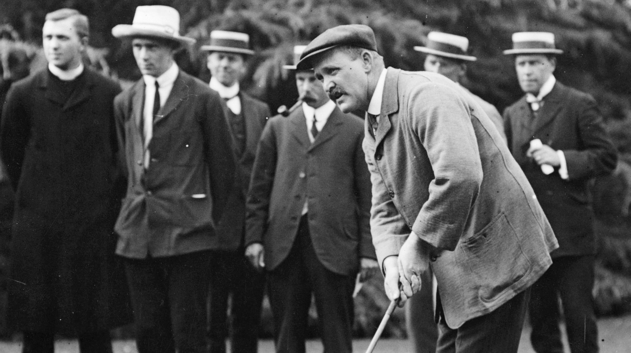 J.H. Taylor putting from off the green