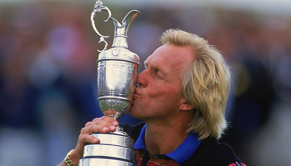 Greg Norman kisses the Claret Jug