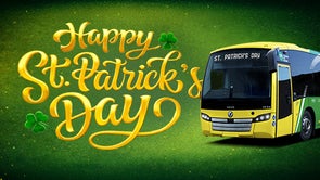 A graphic design saying happy St. Patrick's Day. Below the text is a green and yellow Bus Éireann Bus