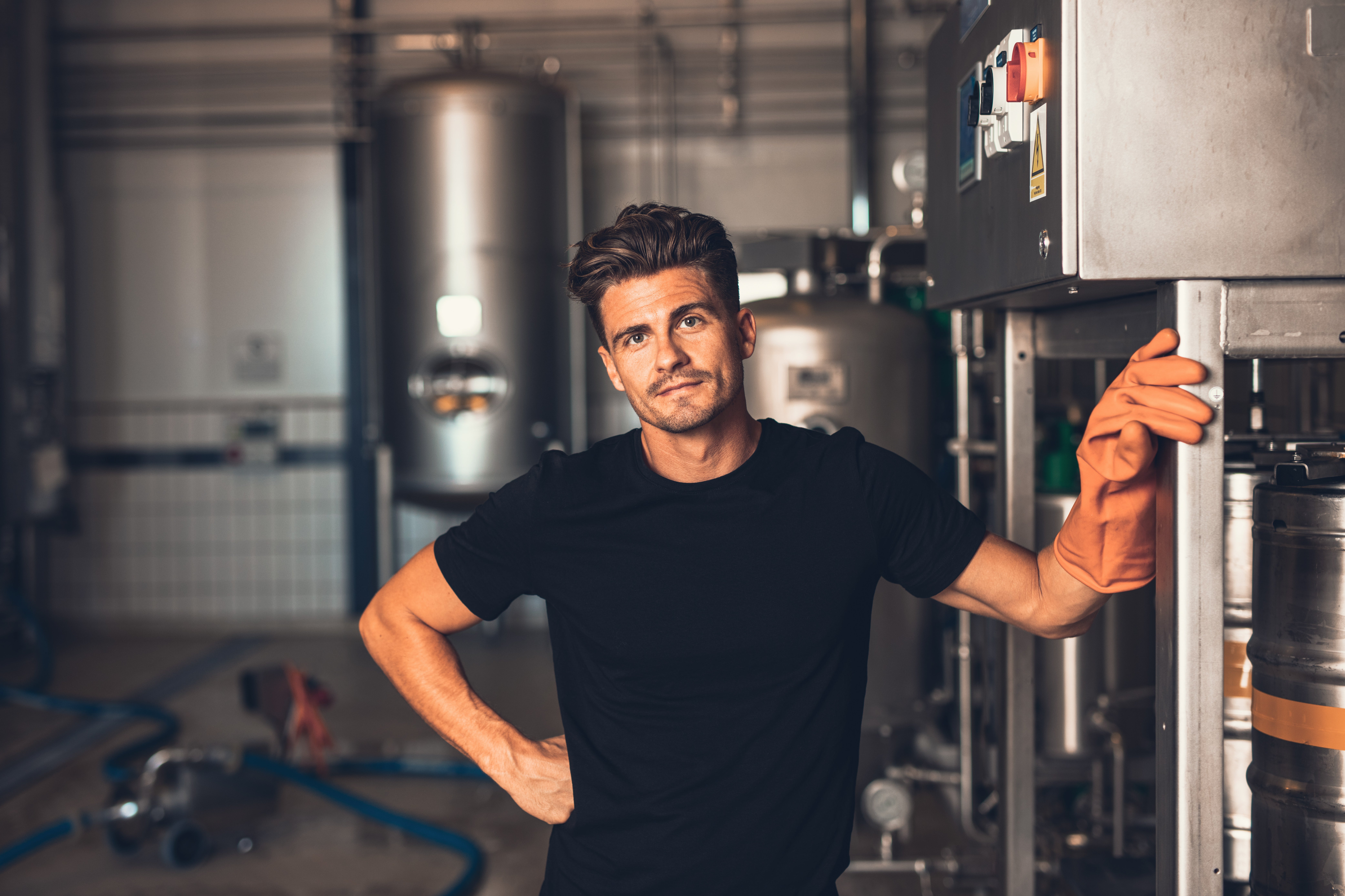 Man standing in front of metal equipment