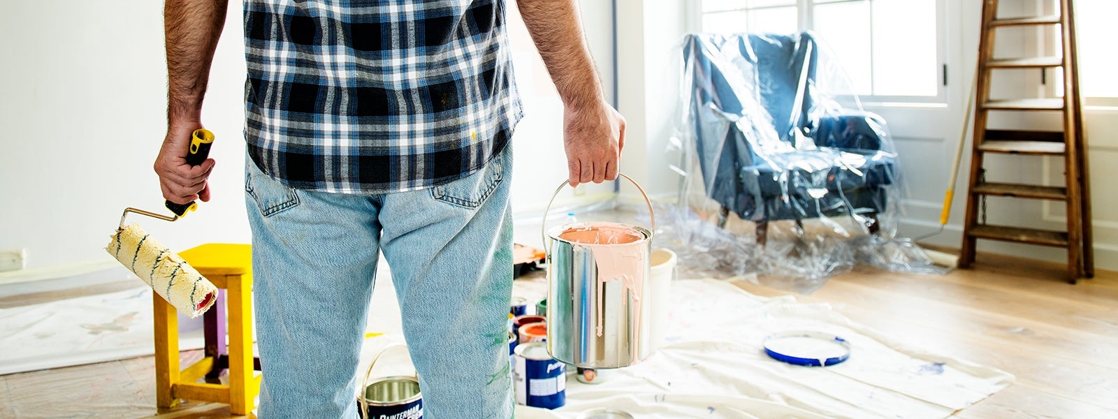 Man holding paint can