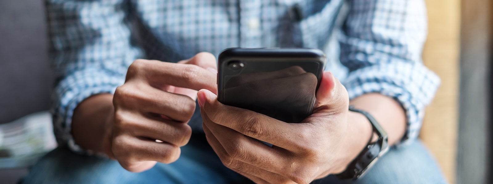 Man browses digital banking on his phone