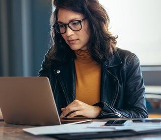Woman looking at laptop