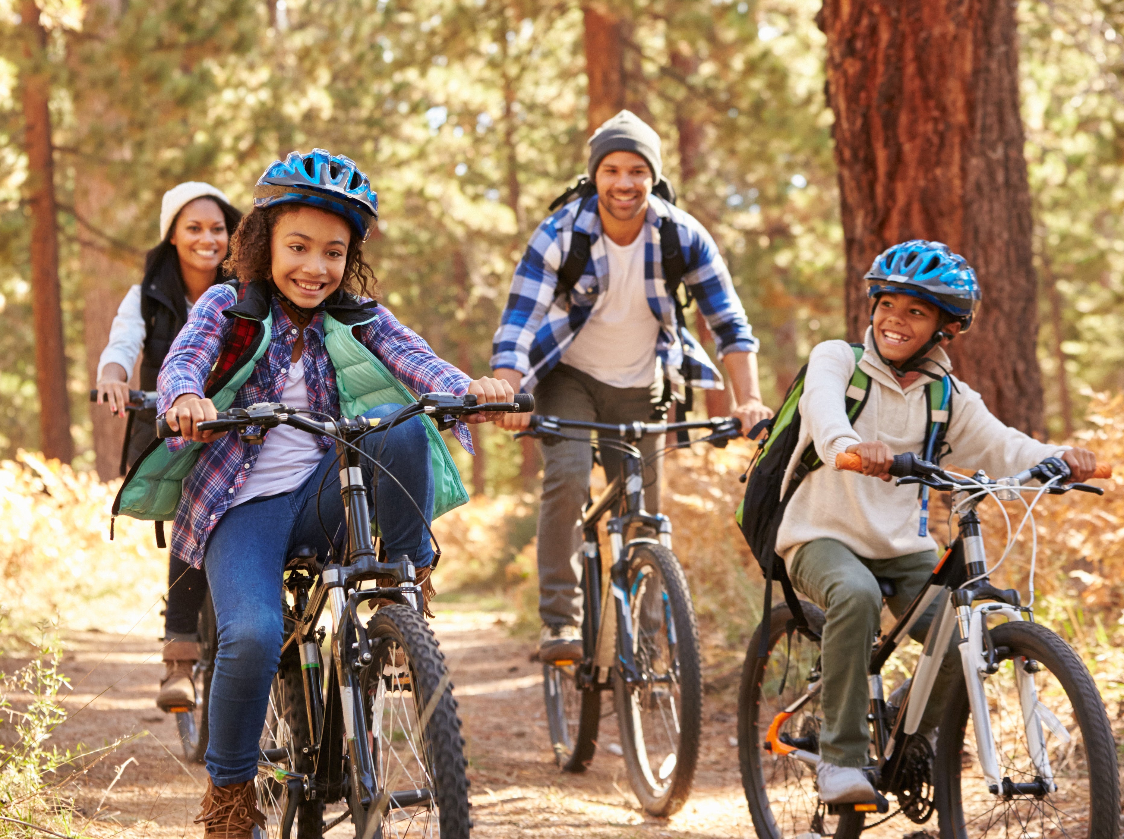 Family rides bikes together