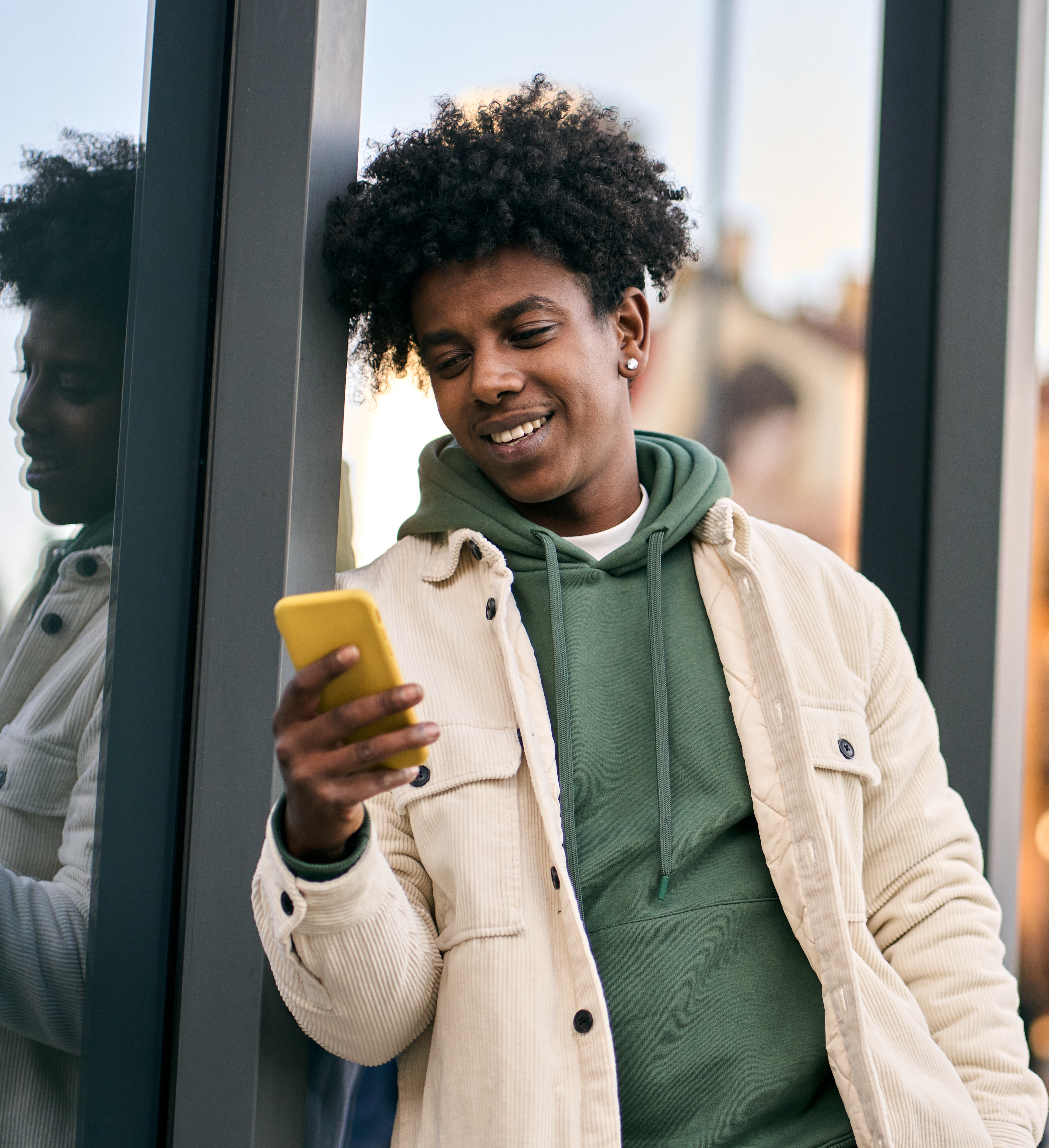 Young man checks phone