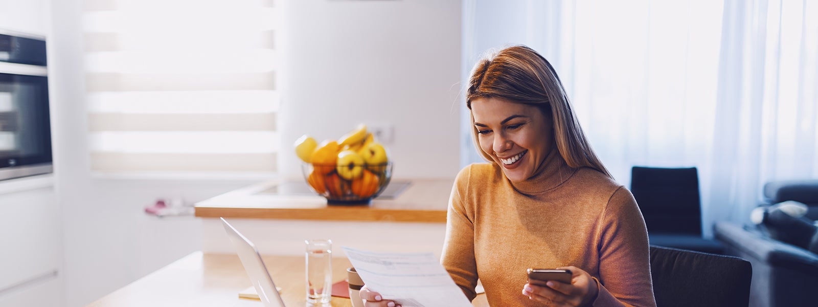 Woman looking at statement smiling
