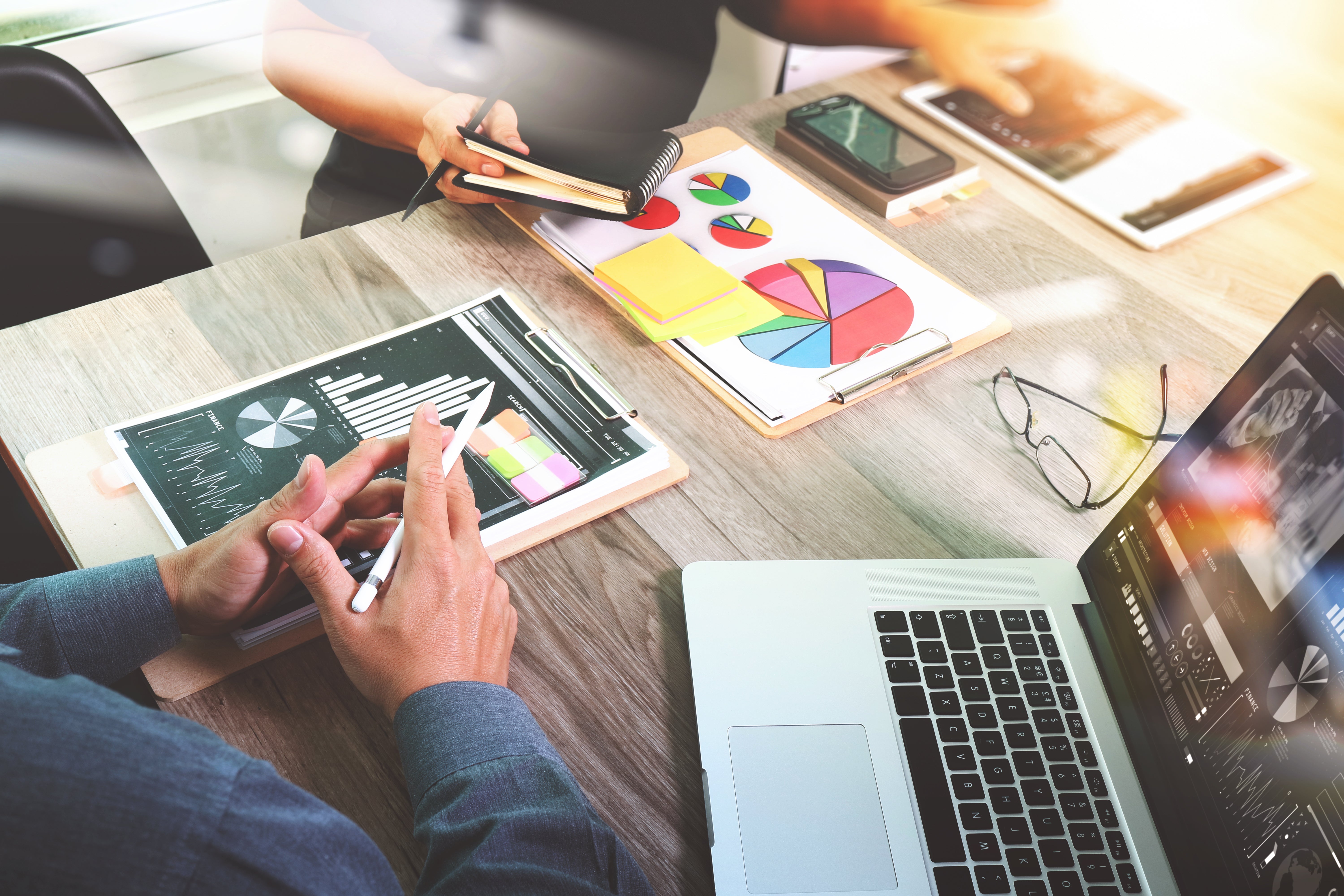 Customers look at financial charts and graphs