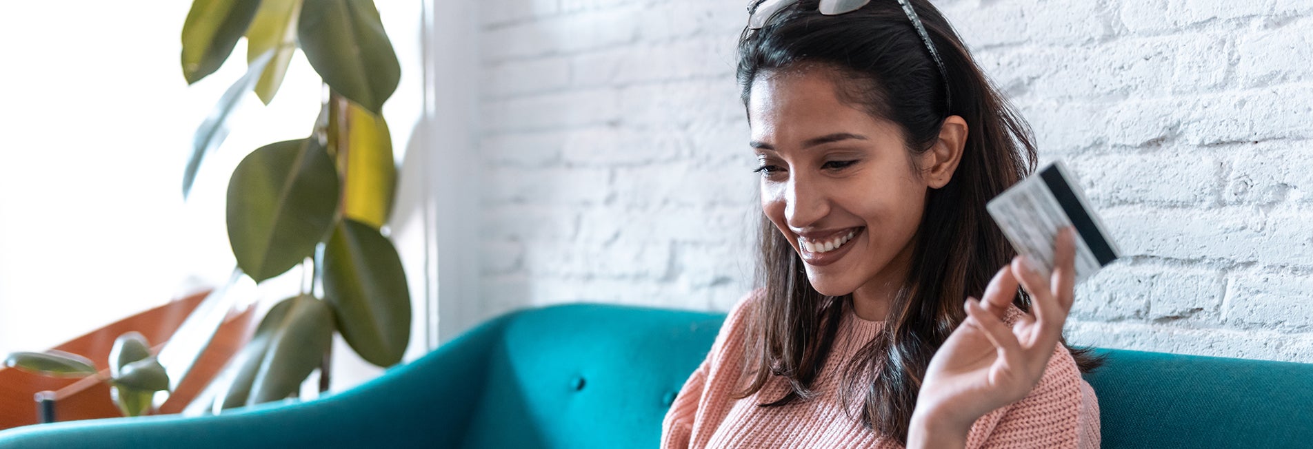 Woman hold credit card while smiling