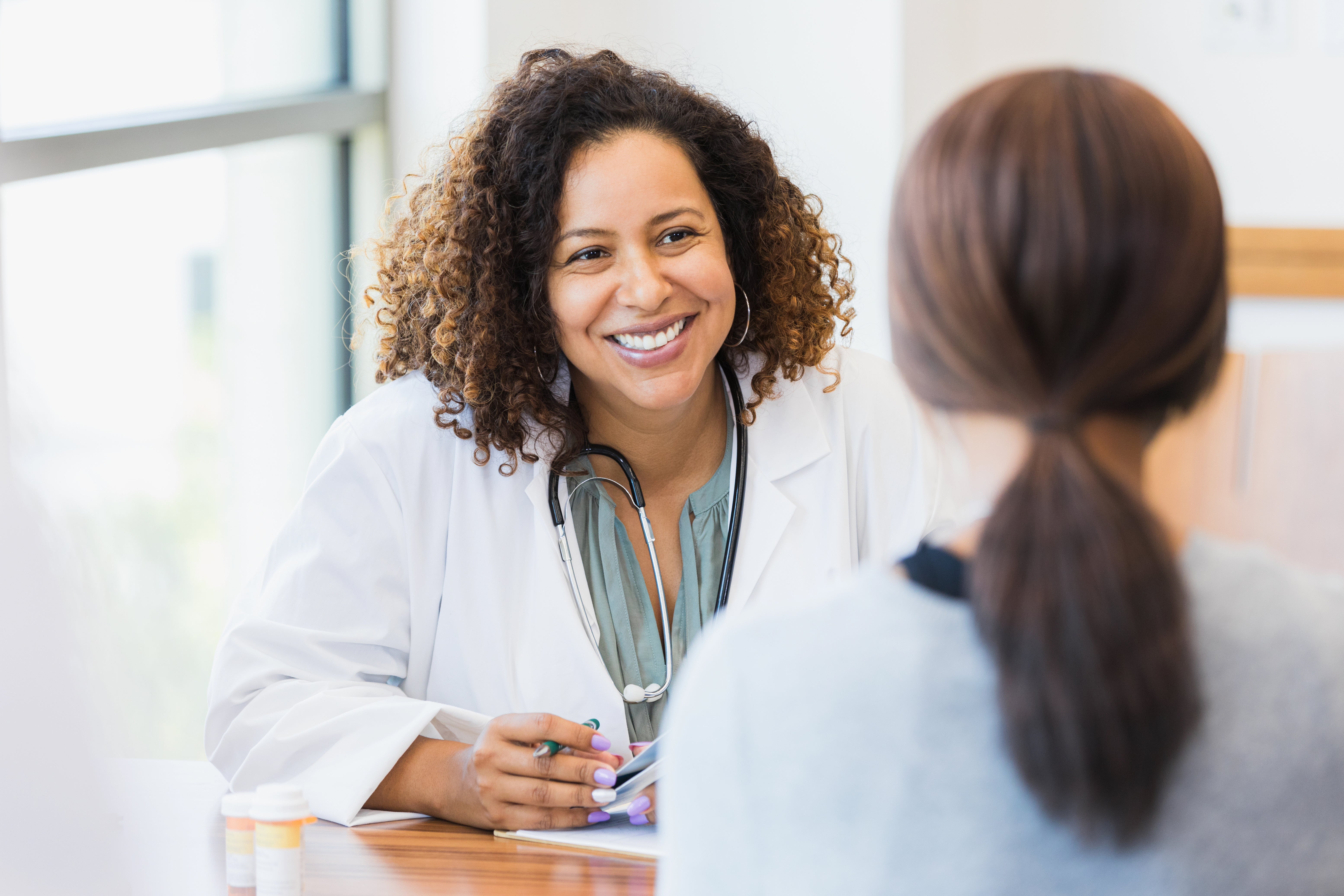 Doctor smiles at a patient