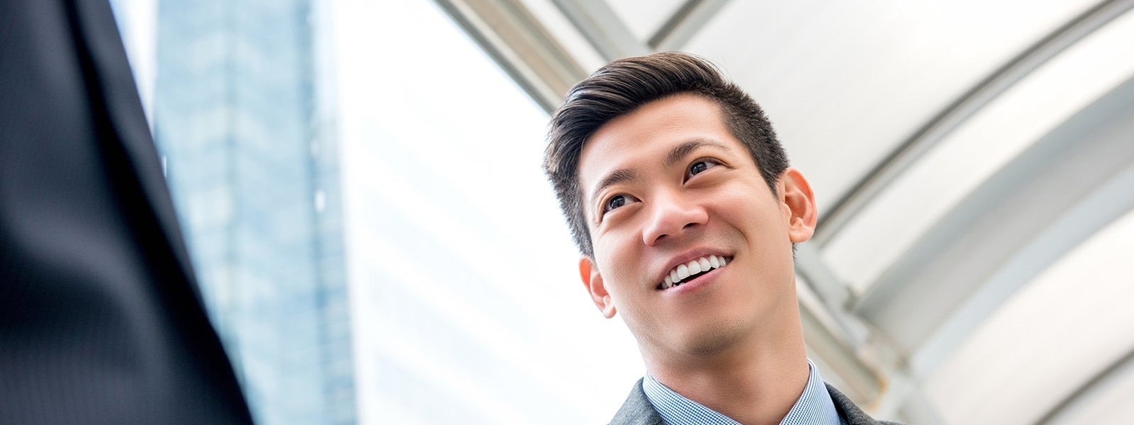 Man in suit smiles