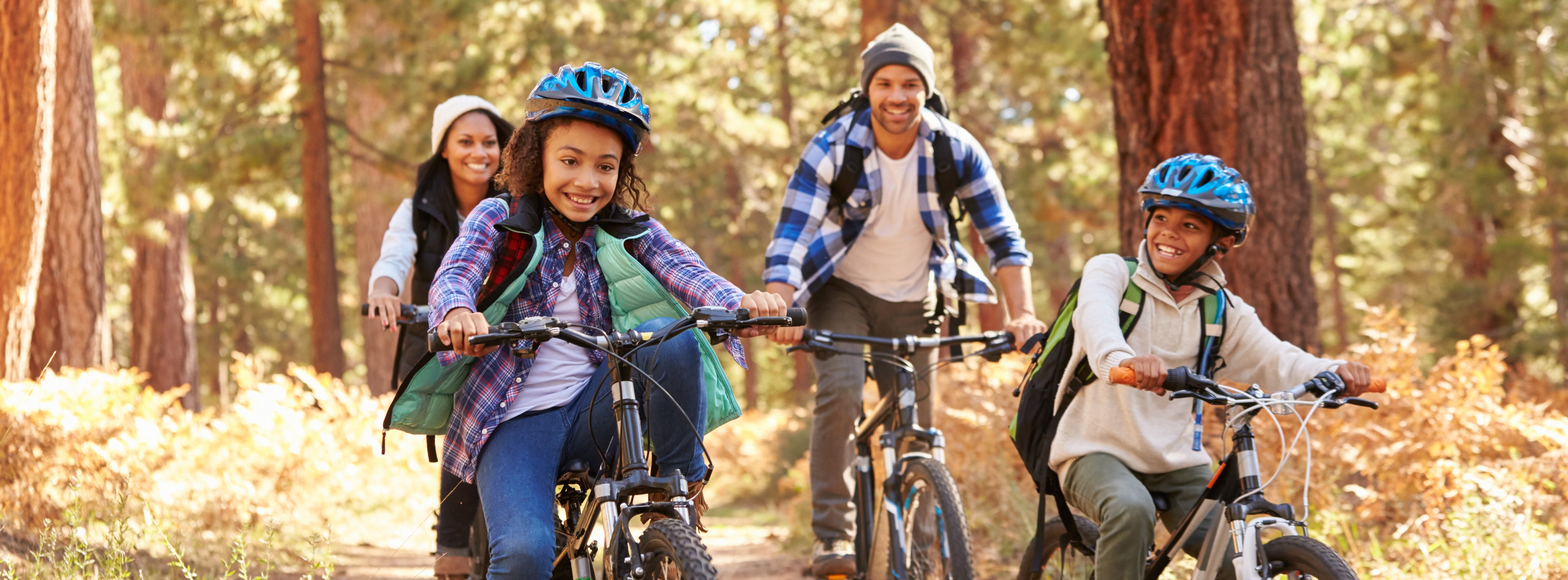 Family rides bikes together