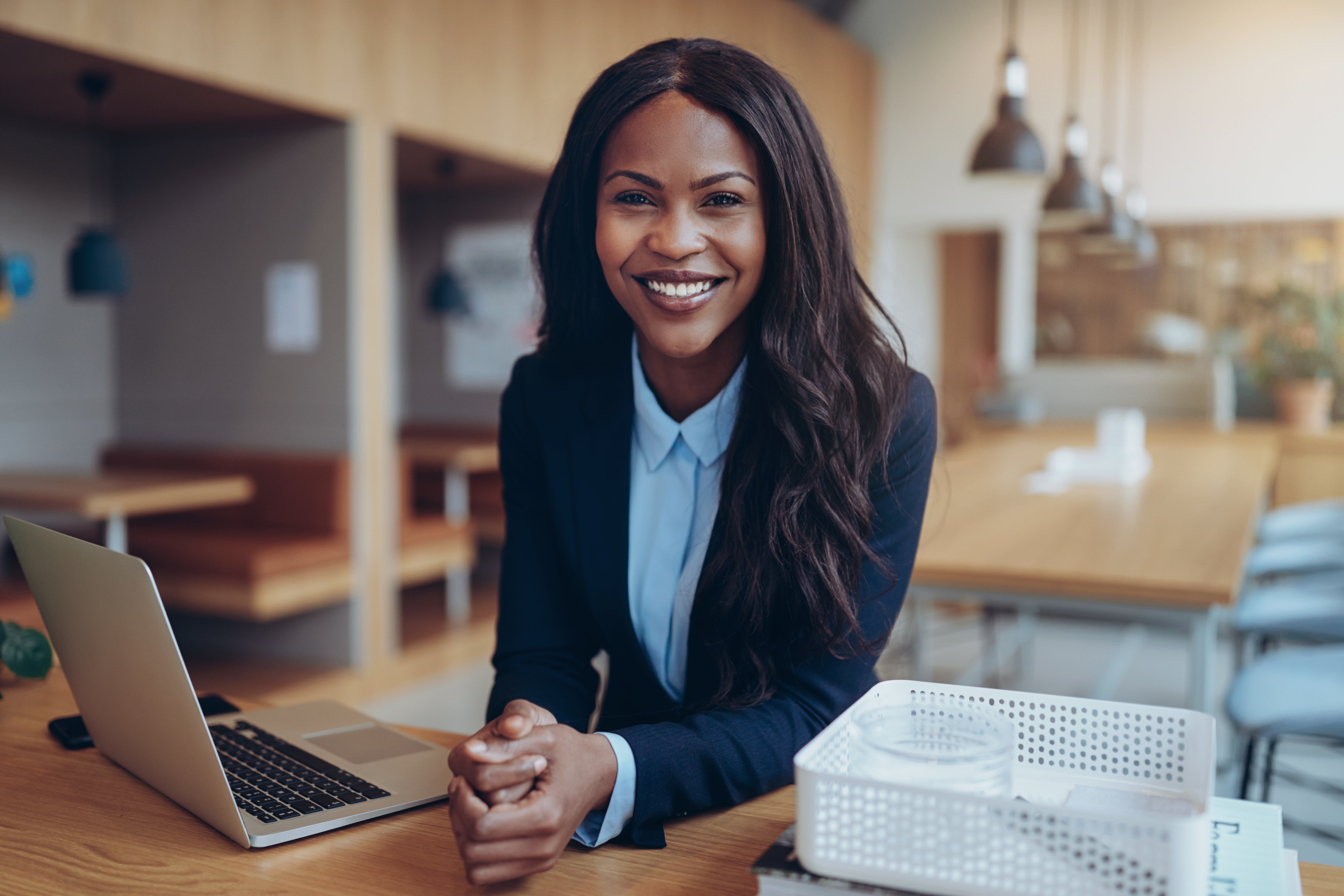 Woman smiling while sitting at desk